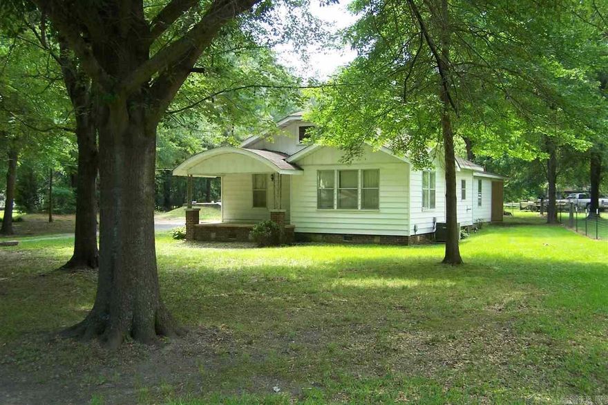 1.8 Acres.  1359 Sq. Ft.  With 2 Bedrooms and 1 Bath.  Great quiet neighborhood with a tree shaded lot.  Great shop with carport parking for 3 boats, trailers, etc.  Can be a great homeplace again.