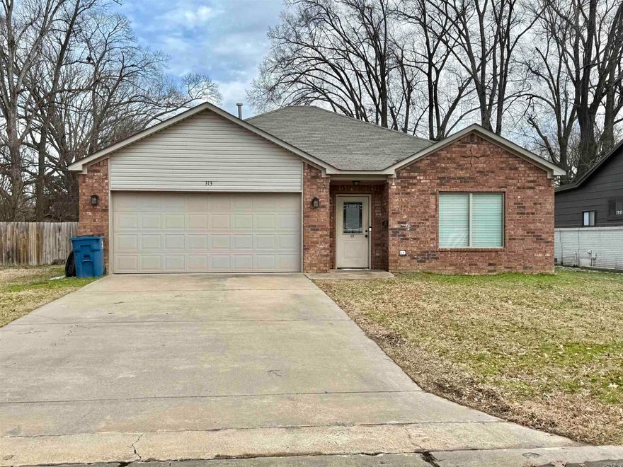 LOCATION!!  LOCATION!!   Beautiful 3-bedroom, 2-bath home in a fantastic location, just minutes from interstate access, shopping, dining, and downtown Benton. Also conveniently located near Hot Springs and Little Rock. The open floor plan features a large living area as well as a stunning kitchen with quartz countertops and wood-look vinyl plank flooring throughout (except bedrooms). New flooring, and a new roof (2021) add to the home’s appeal. The garage motor was replaced in 2024, and a new microwave was installed in 2025. Enjoy a large, fully fenced backyard perfect for relaxation or entertaining.  Also floored attic for additional storage.  There is extra flooring and roof shingles for any replacements needed in the future.  This well-maintained home is a must-see! Contact me or your realtor to schedule your showing today and let's make this YOUR NEW HOME!!!  You don't want to miss this beauty!!