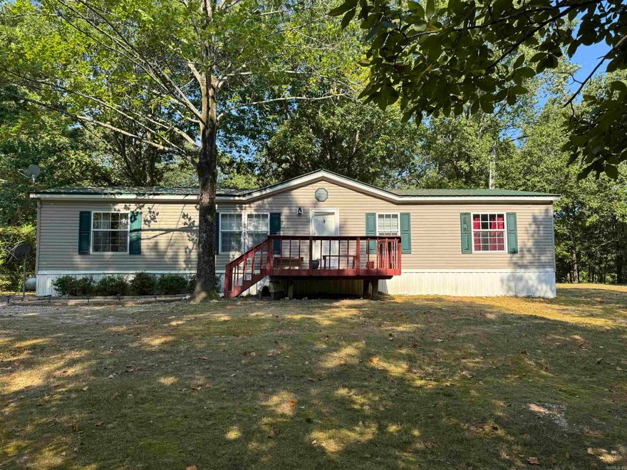 Very well kept mobile home on 3 acres.  The home has 4 bedrooms and 2 bathrooms.  The property is beautiful, the yard is large in the front and back.  With about two more acres that is still wooded for lots of privacy.  The home has a metal roof for low maintenance and also has a nice shop.