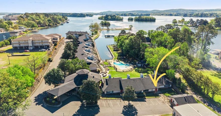 This ENTRY LEVEL condo, with NO stairs, feels less like a condo and more like your own private paradise. The only fully-remodeled, entry level left in Emerald Isle! Emerald Isle is a unique lakefront community with INCREDIBLE amenities, and this newly-renovated, fully-furnished condo is the place where lake lifestyle dreams come true. Walking in the front door, you enter into a light-filled space with luxury finishings throughout- waterfall countertop, new luxury vinyl floors, custom tiled bathroom, and more. Outside, enjoy your private patio and some green space just steps to the pool and lakefront. A stroll down Emerald Isle's private peninsula takes you to to the private beach, mini golf, tennis court, sand volleyball, and basketball court. The swimming pool and hot tub (located just outside the clubhouse) were recently renovated and have a dog run and grilling area for even more recreation and entertainment. At just $250/month, all of these amenities come with one of the lowest POA fees on Lake Hamilton. Make 2026 the year you chose to embrace all that Lake Hamilton has to offer. Schedule your showing today!