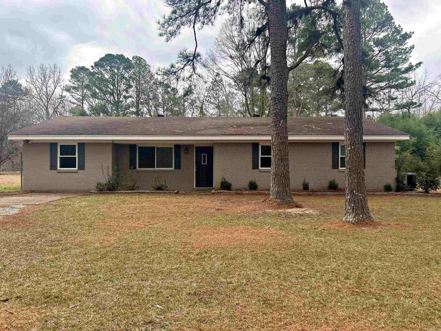 Charming brick range home nestled on 1.5 acres in a peaceful country setting surrounded by mature timber. This 1914 square foot home offers 3 bedrooms and 1.5 bathrooms with a functional, single-level layout. The kitchen features classic oak cabinetry and ample storage. Spacious living areas provide comfort and flexibility for everyday living. Outside, enjoy the added value of a barn, perfect for hobbies, storage, or small livestock. Plenty of open space for outdoor enjoyment while still offering privacy and scenic views. A great opportunity for those seeking country living with room to grow.