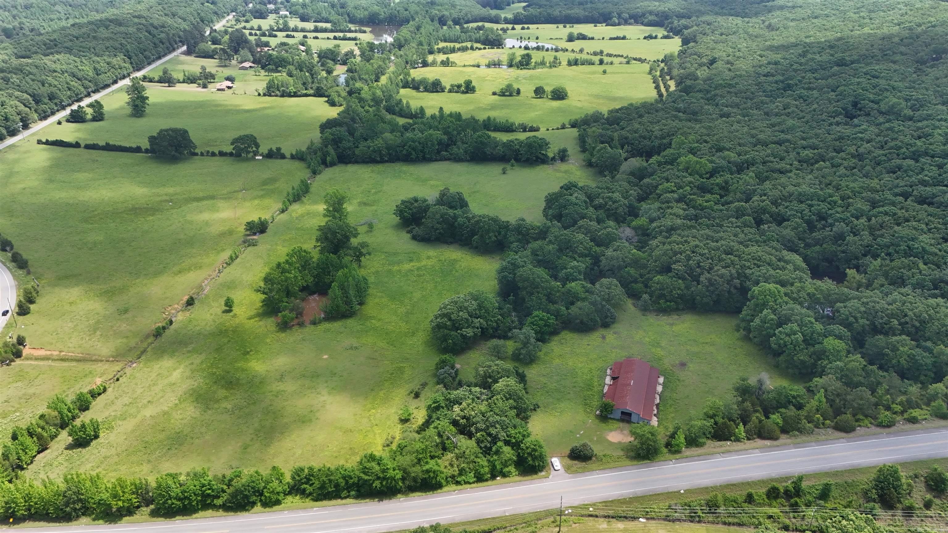 57.90 Acres of land outside city limits, great location to build a home, or for raising cattle. Please see agent remarks for showing.