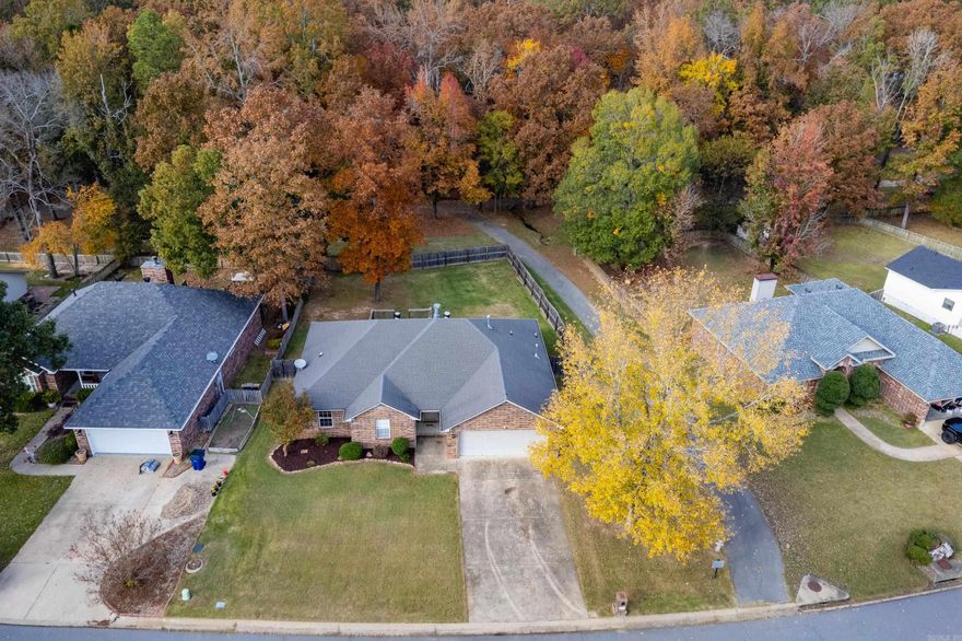 Beautifully situated on the backside of a quiet Maumelle neighborhood, this 4-bedroom home offers a peaceful setting with greenspace and a walking trail directly behind the property. Enjoy a fully fenced, flat backyard with a spacious deck—perfect for entertaining, relaxing, or watching kids and pets play. Inside, the home features an inviting layout with generous living spaces and plenty of natural light. Refrigerator, washer, and dryer all convey, and a new roof will be installed prior to closing, offering added value and peace of mind.