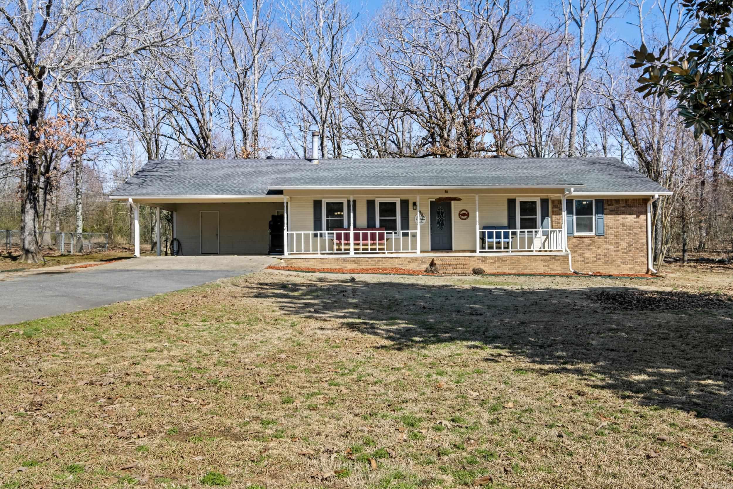 Shut the Front..... Porch! This Adorable home has your Dream front porch Perfect for those Rocking chairs and morning Coffee! Situated on a Corner lot, Over 1.5 acres that is partly cleared & Wooded in the back for Privacy. Open floor Plan, Eat-in dining with Huge breakfast bar, Tons of cabinets and a Picturesque bay window. Cozy wood burning Stove, Oversized living space and Separate laundry room. Storage shed stays. All this and Only 3 minutes to the Freeway! Its the One you've been looking for so Make your appt Today! Agents see remarks.