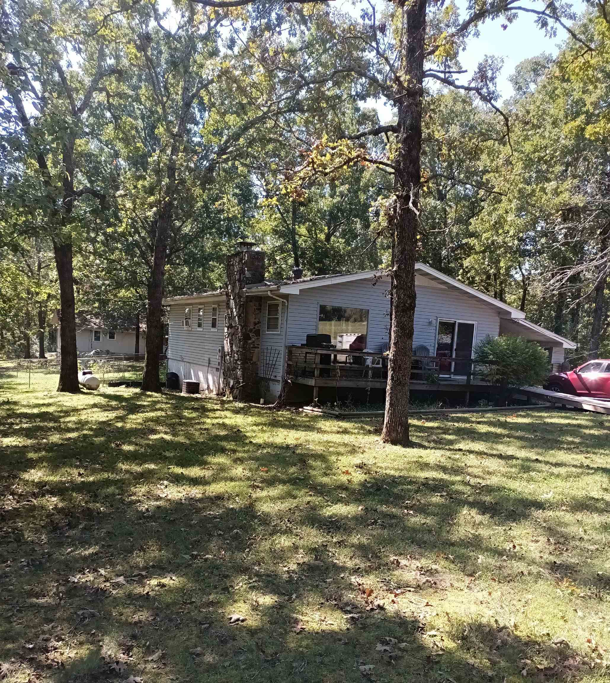 Cottage home in Horseshoe Bend with front and back decks!! Well maintained!! Fenced in yard for fur babies with a short walk to Diamond Lake!!! Close to docks and park! Very short distance to shopping and restaurants! Turkey Mountain Golf Course and Crown Lake activities as well!! 2bd & 1 and half bath w/ laundry room and plenty of storage throughout. Walk in closets and spacious main bath w/ tub. Open floor plan kitchen w/ island including gas fireplace and cozy wood floors in the living area. Large picture windows to enjoy the scenery! Bird watching will be a peaceful past time here. All appliances convey including washer and dryer. Newer range, water heater, roof, and HVAC power board. Deck has ramp for ease of access. Separate gas line for BBQ on front deck for family fun!