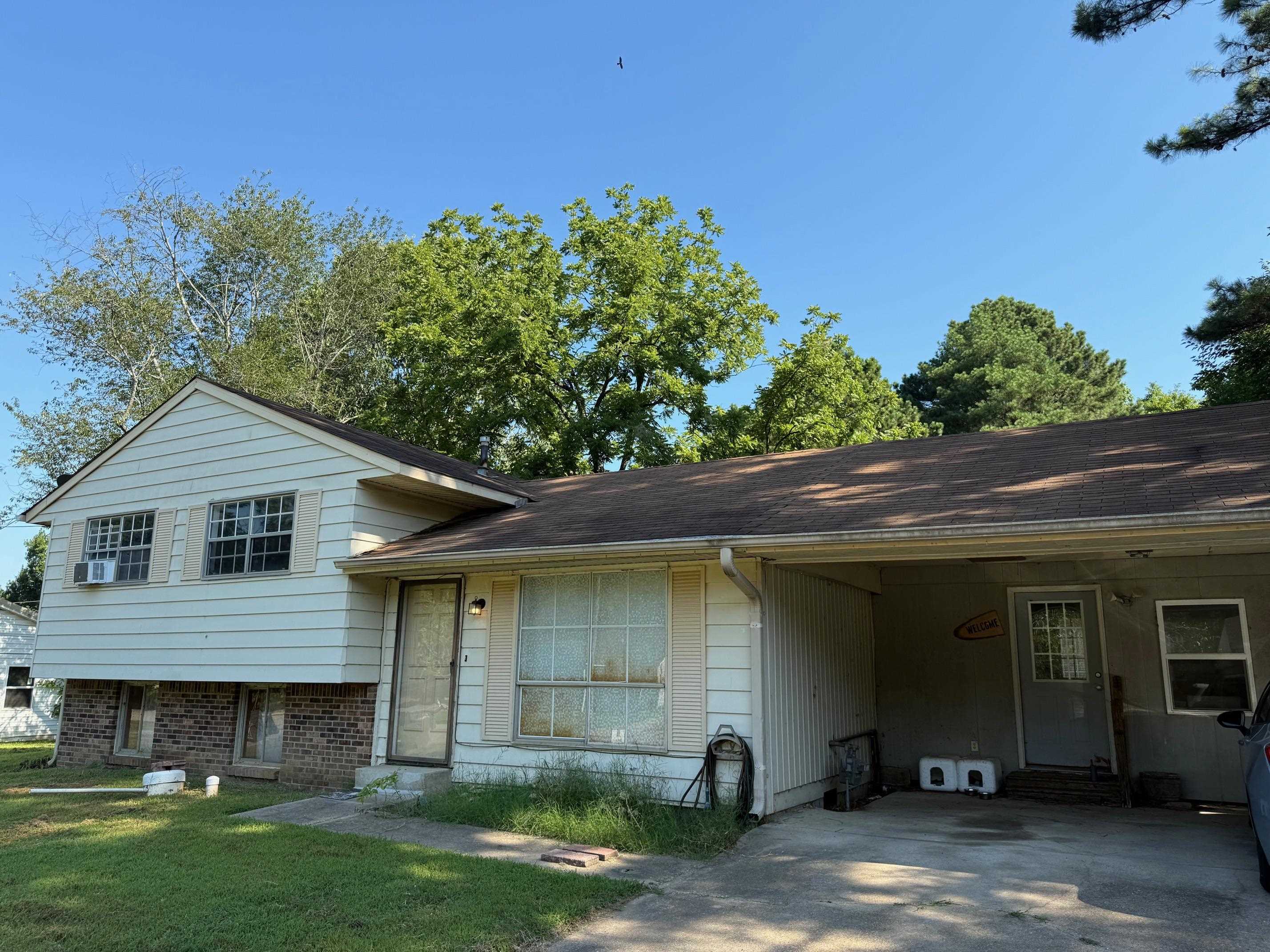 Split level home with 4 beds and 3 full baths priced to sell quickly. The home features a walkout basement, outbuildings, and a large backyard. It's in good condition and would be a great flip, investment property, or forever home with a little TLC.