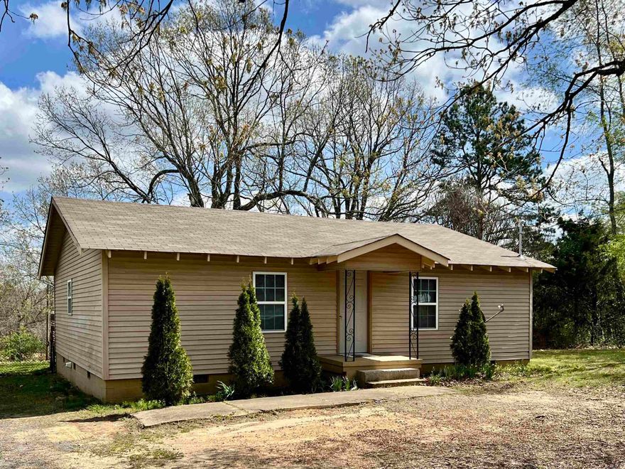 Charming 2 Bedroom 1 Bath cottage on 2 acres! Fresh interior paint gives this home a bright, move in ready feel. Plenty of room to spread out. Ideal for a small homestead, hobby farm, gardening, or just enjoying the outdoors.  Affordable country living with charm and potential. Electric recently upgraded to  200 AMP service and new attic insulation was also installed.