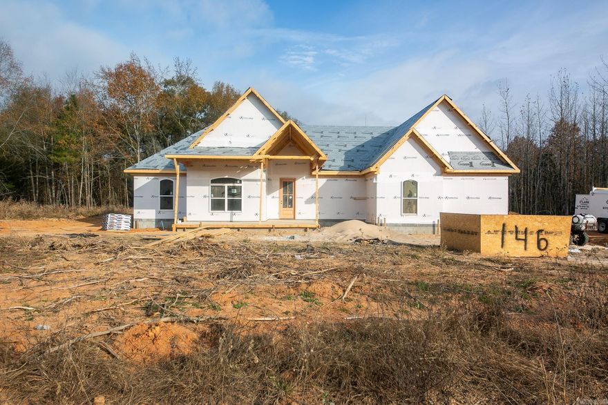 4 Bedroom Home with Bonus room!! Welcome to your dream home! Nestled on a picturesque 3-acre lot just outside the city limits, this stunning new construction offers the perfect blend of modern luxury and serene natural beauty. From the moment you step inside, you'll be captivated by the cozy feel and thoughtful design of this 4-bedroom plus bonus room, 2.5-bath residence. The heart of this home is the gourmet kitchen, featuring quartz countertops and custom cabinets. The oak-colored luxury vinyl flooring throughout the main living areas provides both durability and a warm, inviting aesthetic. For those chilly evenings, gather around the gas log fireplace with loved ones and enjoy the comfort it brings.Retreat to the luxurious master suite, complete with a walk-in shower designed for relaxation. Each additional bedroom offers ample space and comfort, perfect for your family's needs. Estimated completion end of March 2026. Design finishes have already been picked out, and in photos of listing.