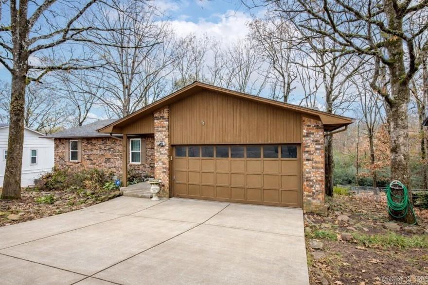 Beautifully maintained 4-bed, 2.5-bath home in the heart of North Little Rock’s Indian Hills subdivision. Inside, you’ll find hardwood floors, ceramic tile, and a spacious layout perfect for everyday living. The large bonus room with a wet bar offers endless possibilities—game room, media room, or entertaining space. Step outside to enjoy the private deck and patio overlooking green space, ideal for morning coffee. Conveniently located just minutes from restaurants, shopping, and local amenities, this home has both comfort and convenience.