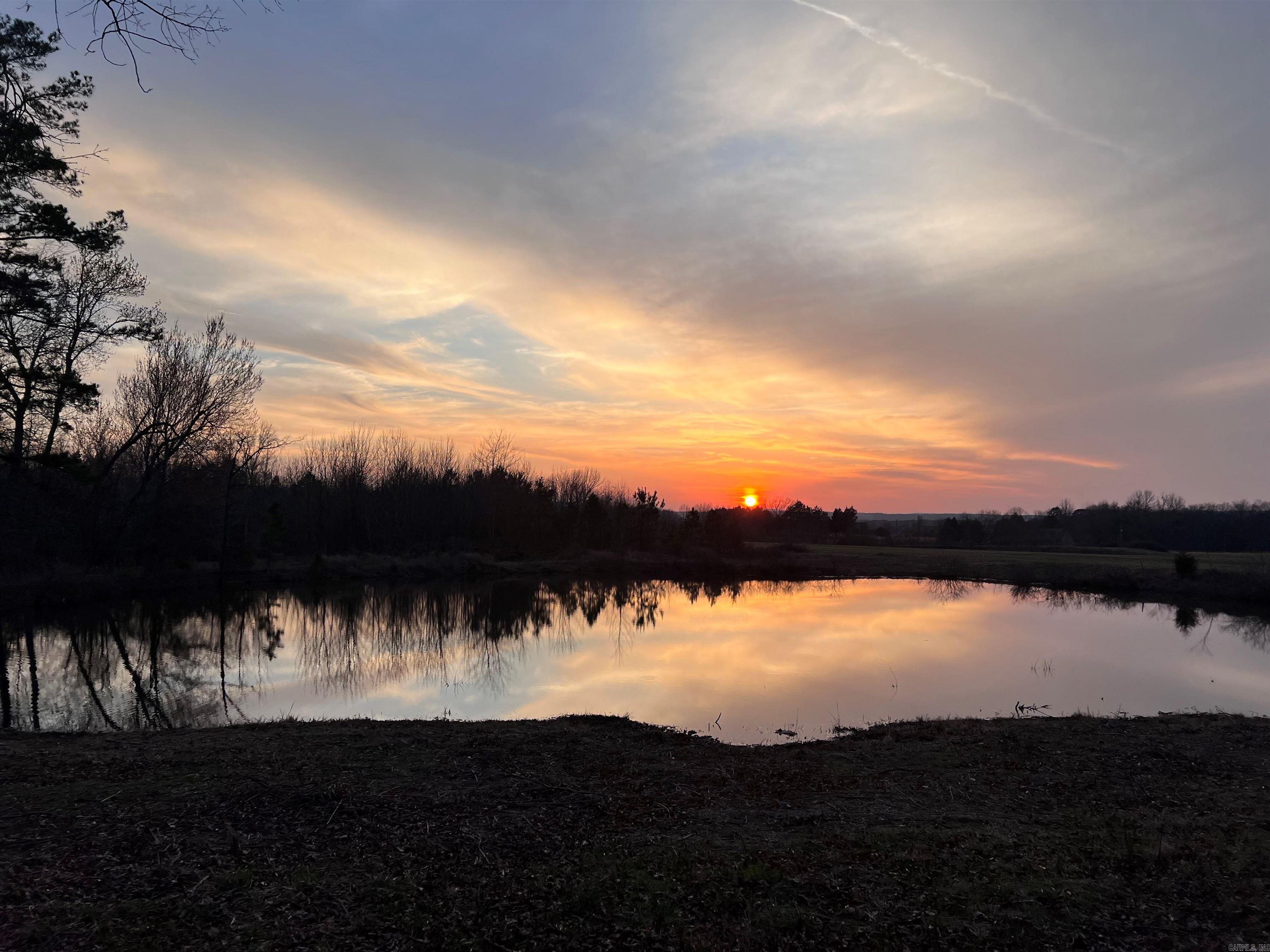 4.863 acres including a nice size pond with beautiful Sunsets & only a short drive to Shiloh Marina. (Tract 8 - see survey and septic permit under "docs") Deed restriction: No Mobiles Allowed. South Dr. is a paved street with utilities running along the road. Great Location to build your Lake House the way you want it! Room for a Barndominium style home plus a Toy Garage for your Boat, SXS, RV, Jetskis, etc. Plenty of possibilities here without having to be in a subdivision. Airbnb's/Vrbo's allowed as well.