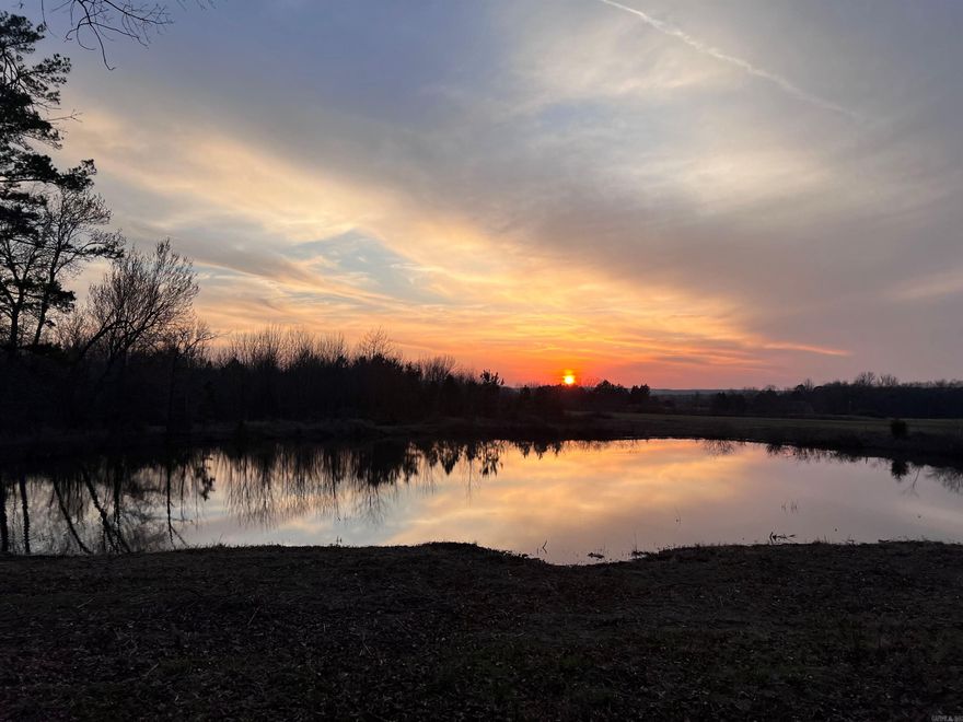 4.863 acres including a nice size pond with beautiful Sunsets & only a short drive to Shiloh Marina. (Tract 8 - see survey and septic permit under "docs") Deed restriction: No Mobiles Allowed.  South Dr. is a paved street with utilities running along the road. Great Location to build your Lake House the way you want it!  Room for a Barndominium style home plus a Toy Garage for your Boat, SXS, RV, Jetskis, etc. Plenty of possibilities here without having to be in a subdivision. Airbnb's/Vrbo's allowed as well.