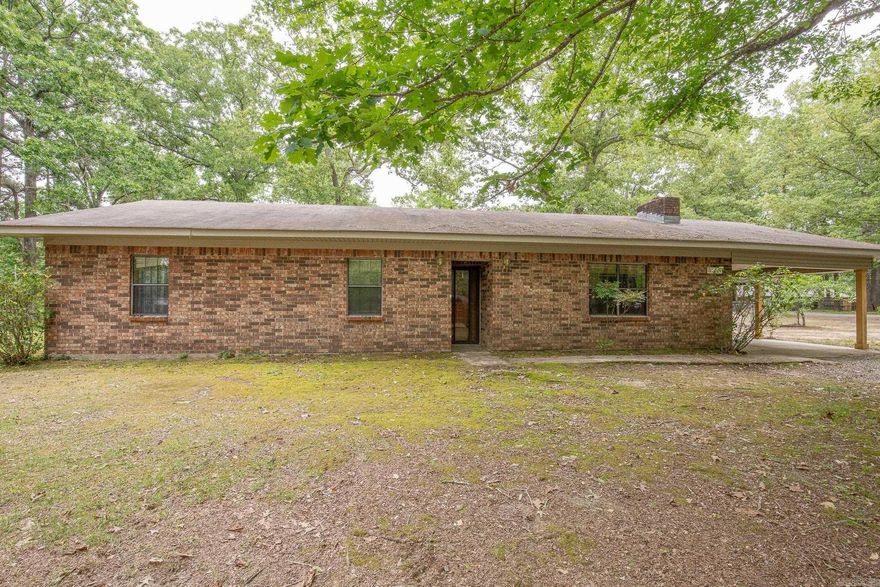 Welcome home to this well-maintained brick beauty offering space, functionality, and room to grow—all situated on 2.5 acres across two lots!  Inside, you’ll find updated vinyl plank flooring and a thoughtfully designed layout featuring a massive living area centered around a cozy wood-burning fireplace—perfect for gathering with family or entertaining guests. The home offers two full bathrooms, a dedicated office space ideal for working from home, and a generously sized laundry room that adds everyday convenience.  A separate dining area flows seamlessly to the outdoors through sliding glass doors, leading to a large fenced backyard—great for kids, pets, or simply enjoying the peace and privacy of your land. Recently added, the covered patio creates the perfect spot for relaxing or hosting year-round.  For those needing extra storage, workspace, or hobby space, the 30x50 shop is a standout feature—complete with a concrete slab, 220 electric, and an overhead door.  Major updates include a roof approximately 7 years old and an HVAC system around 10 years old, giving peace of mind for years to come.