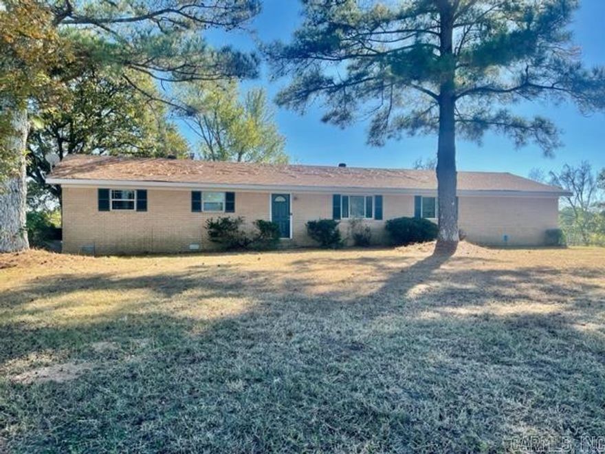 Take a look at this 3 bedroom family home in the country! Maintenance free exterior with brick and vinyl siding. Newer roof, heat and air, and hot water heater. The large double carport has a storage room and could easily be converted to a garage if a door was added. The great room is large and has extra space for a formal dining room, or a play area, so everyone can be together. The kitchen was recently updated with granite counter tops and appliances. There is a large space for an office off the kitchen. The hall bathroom is large and has a linen closet. All of the bedrooms are a nice size and will accommodate a large family. The back yard is fenced and cross fenced for a dog run or extra room to build a shop. This property qualifies for the USDA Rural Development Loan so you can buy with no down payment! Give us a call to see this beautiful family home!