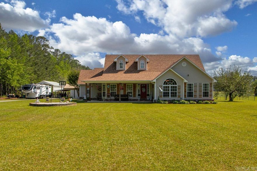 Welcome home to this well-maintained 3 bedroom, 2 bath property that was built in 2007 with 2,010 sq. ft., 3.52 acres & a nice shop!  Inside, you’ll find new vinyl plank flooring in the living room, primary bedroom, and primary bath, along with a beautifully updated walk-in shower in the primary suite. The spacious layout includes a large laundry room, pantry, and a separate dining area that could easily serve as a home office, playroom, or additional flex space. The kitchen comes complete with refrigerator to convey, newer dishwasher, and electric stove.  Major updates provide peace of mind, including a new roof in 2023, HVAC replaced in 2023, and water heater installed in 2026.  Step outside and enjoy the charming curb appeal with cedar accent posts and shutters, inviting porches, and a fenced backyard. For those needing storage, workspace, or room for hobbies, this property truly shines with a 30x40 shop featuring 16-foot side sheds on each side, a 32x40 camper shed, attached garage, an adorable she shed & acreage to roam.  If you’ve been searching for a home with space, acreage, and incredible outbuildings, this one checks all the boxes!