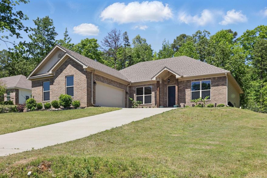 Welcome Home to Pinewood Estates. This well maintained home is ready for your family. The Living area has 10' ceiling w/wood burning fireplace & is open to kitchen. Kitchen has custom cabinets w/ez-close drawers, granite counter-tops & s/s appliances. Crown molding in all rooms. Hardwood floors in LR, kitchen, dining, & hall. Ceramic tile floors in baths & laundry. Split floor plan. Master BR has tray ceiling. Master bath has sep. shower, soaker tub, & a large u shaped walk-in closet. Laundry room w/lots of storage. Approx 0.68 acre lot. Bryant Schools. AT&T U-Verse Agents see Remarks.