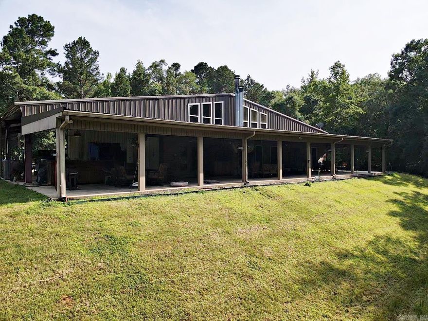 This is a luxury, one-of-a kind Barndominium sitting on 8.02 acres, minutes from Lake Degray. It has over 3,000 sq ft living space plus a large shop all under one heated and cooled roof. Also under this roof on the outside are two covered carports and a large porch that spans across the back with an outdoor fireplace and living space. There is also a large one bedroom one bath upstairs with a beautiful view. Storage is bountiful with a large laundry room and closets on both levels.  There is also a hidden closet, a 25KW Diesel generator and a 38 X 58 RV Shop are only a few of the extras on this property.  It is a must-see property.  Schedule an appointment today, this one will not last long!