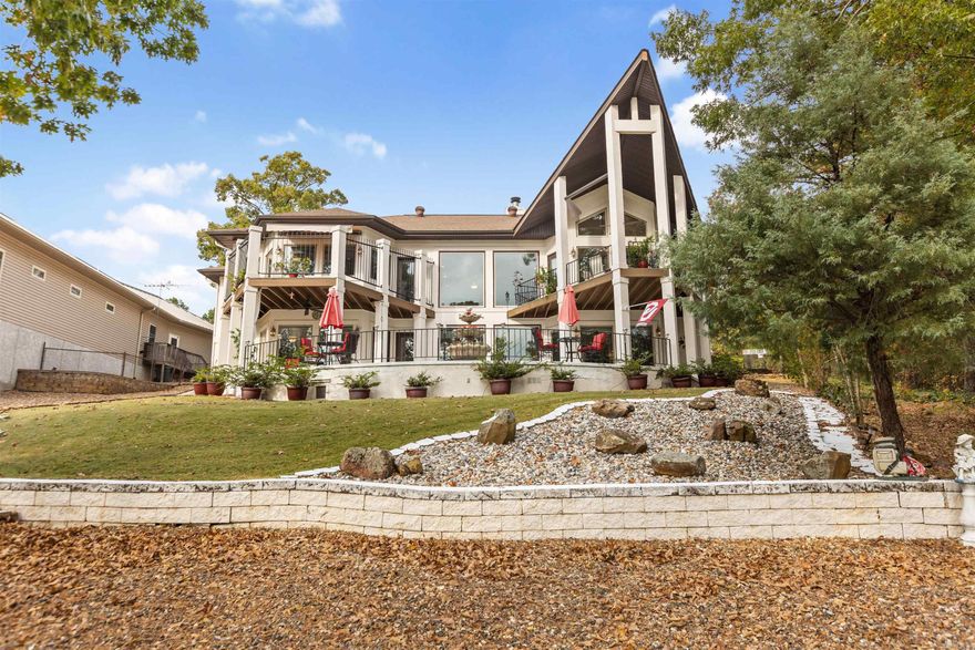 Welcome to your dream home on the 18th green of the prestigious Ponce de Leon golf course! This stunning property offers exceptional amenities and thoughtful upgrades, making it a true gem in Hot Springs Village. Step inside to find a grand curved staircase, upgraded professional landscaping with leaf filters, and a newer HVAC for ultimate comfort. The chef’s kitchen is a masterpiece, featuring an impressive 97 feet of granite countertops, two microwaves, and ample space for preparing gourmet meals or hosting gatherings. This home has a versatile man cave and workshop area that could easily serve as a 4th bedroom, perfect for guests or hobbyists alike. A 10x10 tornado shelter provides peace of mind, while the primary suite offers a massive 20x15 walk-in closet and a hot tub!  The oversized three-car garage ensures plenty of room for vehicles, tools, and storage. With its prime golf course location, stunning landscaping, and luxury finishes throughout, this home combines elegance, functionality, and relaxation—ideal for both entertaining and unwinding. Don’t miss out on this one!