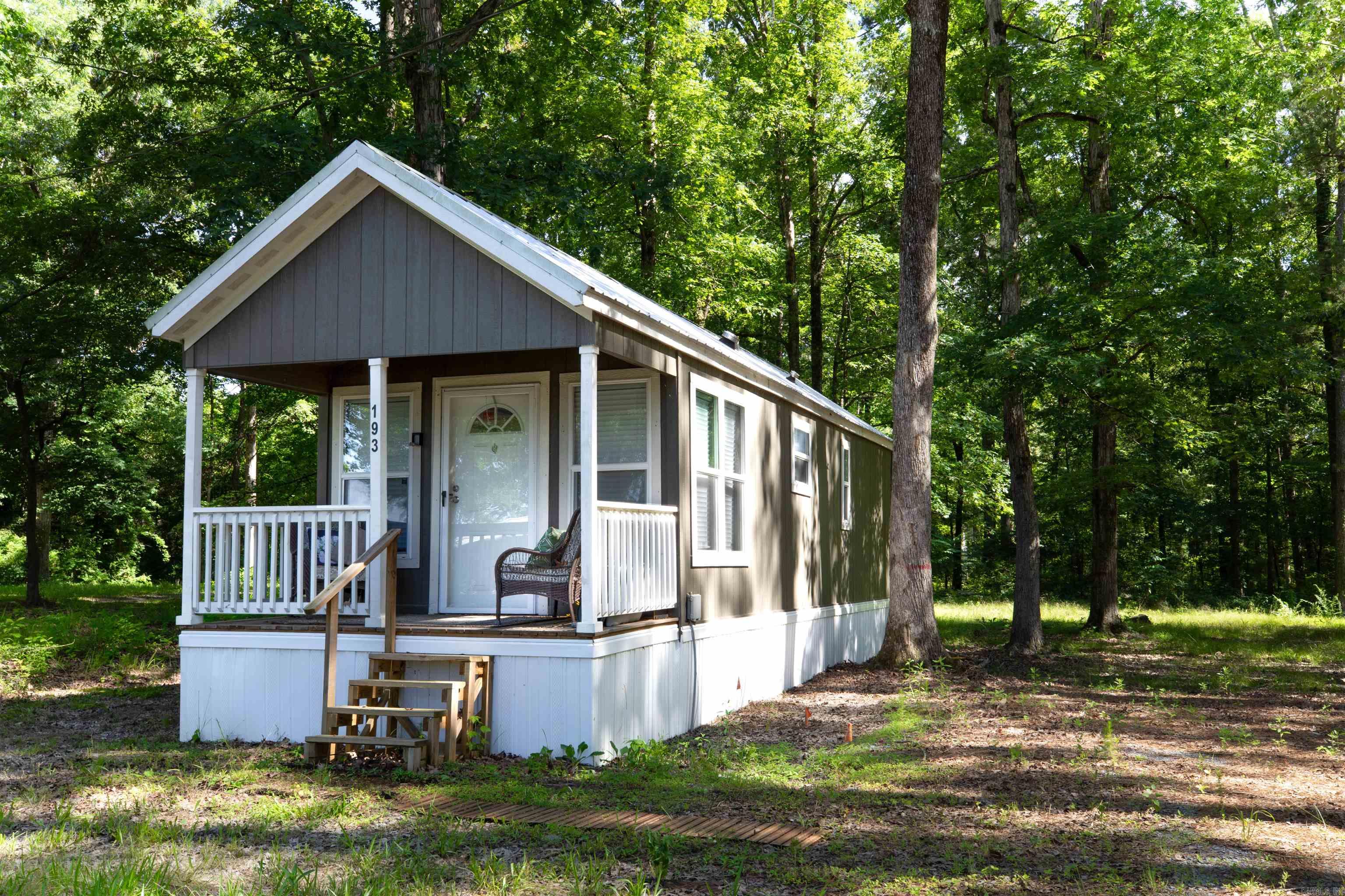 Move-In Ready 1-Bedroom Tiny Home with Modern Finishes – Perfect Starter or Rental Opportunity! Located between White Hall and Sheridan with quick access to I530, this beautifully updated 1-bedroom, 1-bath home offers stylish, low-maintenance living just outside the city limits. Located in Sheridan School District! With all-electric utilities and gas available, this property is as efficient as it is convenient. Featuring modern finishes throughout, including a sleek stainless steel sink, an electric stove, a stackable washer/dryer, and along with additional contemporary design touches, it’s move-in ready and hassle-free. All appliances are included, making it an ideal option for a first-time homebuyer, travel nurse, or savvy investor seeking a turnkey rental. Enjoy peace and privacy outside the city, while still being within easy reach of amenities. Whether you're looking to downsize, invest, or simply settle into a low-maintenance lifestyle, this charming home is ready for you!