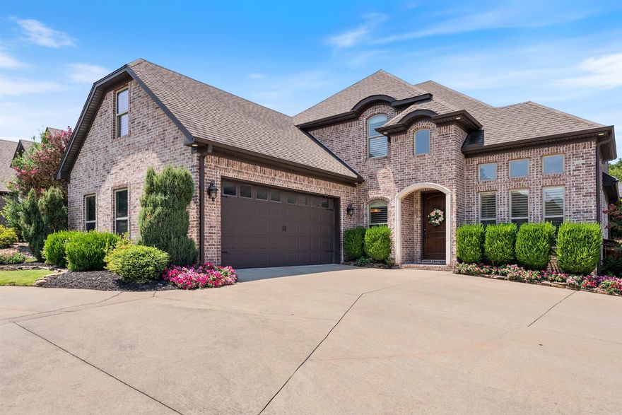 Beautiful home located in Chenal Valley with golf cart access to the Chenal Country Club and Golf Course. This classic brick home offers timeless curb appeal and convenience—just minutes from dining and shopping. A circular drive welcomes you into a gracious two-story foyer with hardwood floors. The office features French doors, 12-ft ceilings and beautiful custom windows adjacent to the formal living room (or dining room) with access to the kitchen. The kitchen was designed for preparing family meals with granite countertops, a gas cooktop, wall oven, large island with bar stool seating, and two pantries. The kitchen is open to the breakfast area and spacious great room with a gas log fireplace and surround sound. The main-level primary suite is a retreat with a spa-like bathroom including his-and-her vanities with makeup area, soak tub, shower and a spacious walk-in closet. Upstairs features two bedrooms, a full bathroom, and a game room or 4th bedroom (sellers will create closet upon request). Outdoor living includes a covered patio with wood-burning fireplace, deck, and fenced yard. New roof (2025) with transferable warranty w/ Certainteed shingles by Arkansas Roofing.