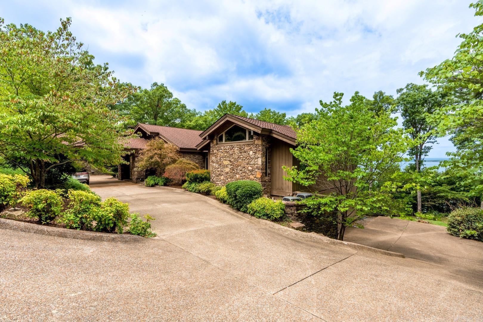 Eden Isle Lakefront home built in 2005! This rustic contemporary beauty includes 4 bedrooms, 4.5 baths, 2 living areas, slate floors, granite tops, walls of glass and stone, custom wood finishes and some of the best lake views on Eden Isle! Built by Dwyer Construction.
