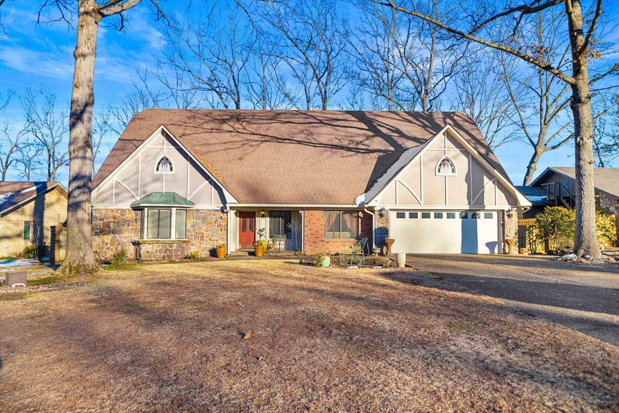 AMAZING VIEWS with this BEAUTIFUL LAKE HAMILTON brick & stone home on level lot that features 5 bedrooms 3.5 baths and approx 4,358 sq ft at the end of a quiet street. This home would make a great family home or weekender. It is nestled right on the waters edge with seawall, 1 stall covered boat dock as well as a swim platform. Well maintained with beautiful landscaping with fire pit overlooking the lake and separate storage shed. This home features numerous porches with sitting areas to relax, entertain and enjoy the lake. Upstairs has a separate suite for total privacy and 1 extra room that could be considered a 6th bedroom. The beautiful, open concept chef's kitchen is perfect for entertaining. So many extras including stainless appliances, granite countertops, gas cooktop, several living areas to enjoy inside and out. Also comes with refrigerator, washer & dryer. Minutes from shopping, dining and hospital.