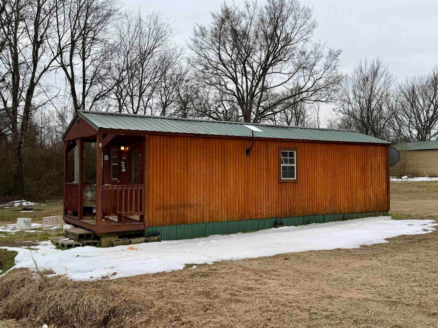 Modular-style, energy-efficient home built in 2017, located in Hartman on a .48-acre lot just minutes from the Horsehead Creek boat launch with access to the Arkansas River. This all-electric home features an open-concept kitchen, living, and dining area, with all appliances conveying—including a window unit and an efficient electric fireplace heater. The private bedroom offers a full bath ensuite, and the cozy covered front deck is perfect for relaxing. Ideal as a primary residence for someone looking for a low cost affordable home.