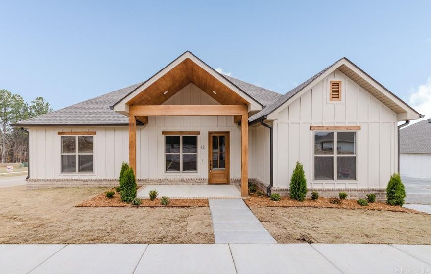 Discover this stunning Craftsman-style home nestled in Bryant's most desirable neighborhood! Boasting custom designer finishes throughout, this residence offers a blend of elegance and practicality. Its prime location provides the convenience of a short stroll to the neighborhood pool.  Imagine relaxing on the welcoming front porch and enjoying the nearby weekend farmers market. The home's thoughtfully designed layout features an open kitchen and living room, bathed in abundant natural light. Large Back Patio.