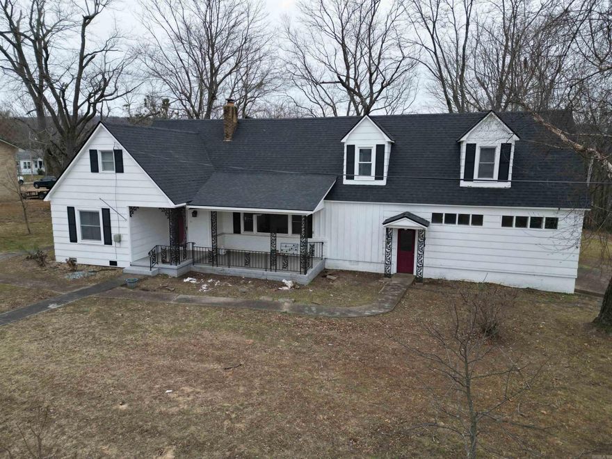 BRAND NEW ROOF on a vintage craftsman style house with plenty of charm and character. Inside the city limits, and within walking distance to downtown Marshall, this home is just the right size.  With all the nooks and crannies, this home stands out differently from so many others.  With a little TLC you could bring this up to date, or keep the retro look alive and well.  There are plenty of rooms for family members, a study, storage, game room, office, and hobby room. Protect your vehicles with the garage and carport in the back yard. There is a shed out back for more storage or a small shop. Majestic trees cover the back yard giving shade and more a more manageable  yard than a rural lot.    Be that homeowner who takes pride in this unique home. Stand out with your own style in Marshall, AR and enjoy the Ozarks living.   Buyer to verify square footage. Sold " as is, where is".