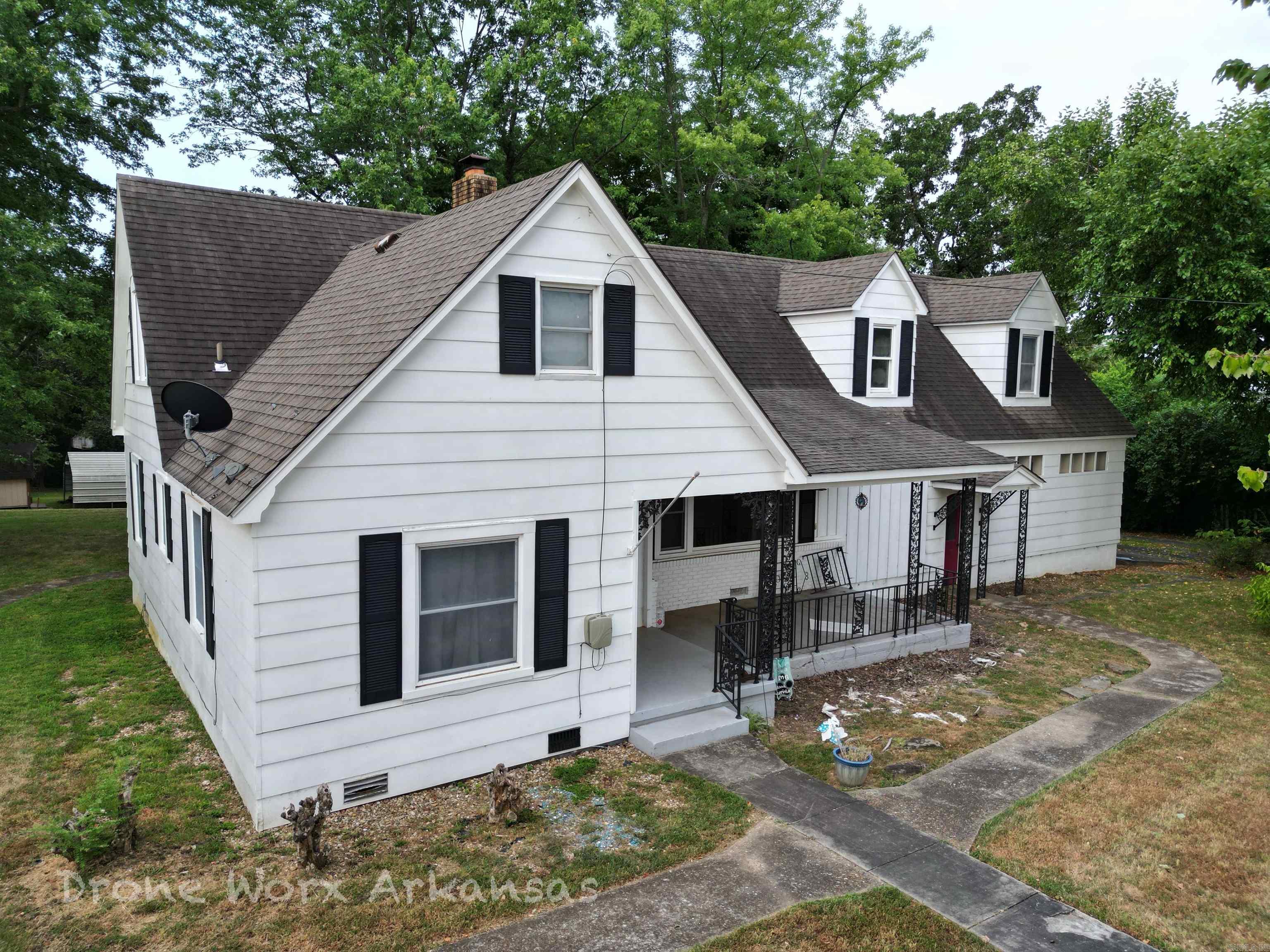 A vintage craftsman style house with plenty of charm and character. Inside the city limits, and within walking distance to downtown Marshall, this home is just the right size. With all the nooks and crannies, this home stands out differently from so many others. With a little TLC you could bring this up to date, or keep the retro look alive and well. There are plenty of rooms for family members, a study, storage, game room, office, and hobby room. Protect your vehicles with the garage and carport in the back yard. There is a shed out back for more storage or a small shop. Majestic trees cover the back yard giving shade and more a more manageable yard than a rural lot. Be that homeowner who takes pride in this unique home. Stand out with your own style in Marshall, AR and enjoy the Ozarks living. Buyer to verify square footage. Sold " as is, where is".