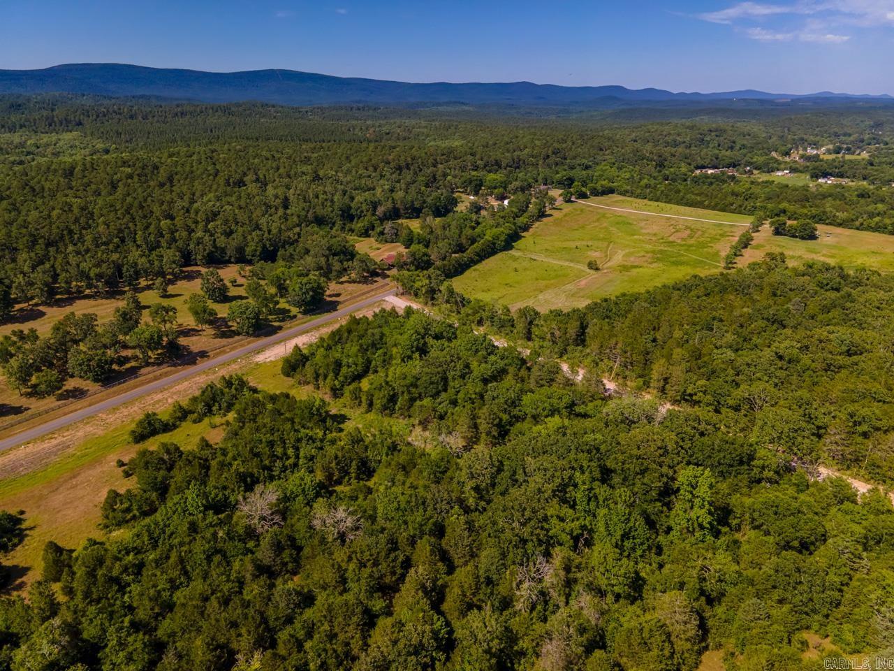 Amazing location just a couple minutes from the north shore marina. Perfect spot to get away and enjoy all that Lake Ouachita has to offer. 16 acres with gated driveway that has been graveled. The long drive leads to two building site pads that have already been built for you. The wooded acreage backs up to the national forest.