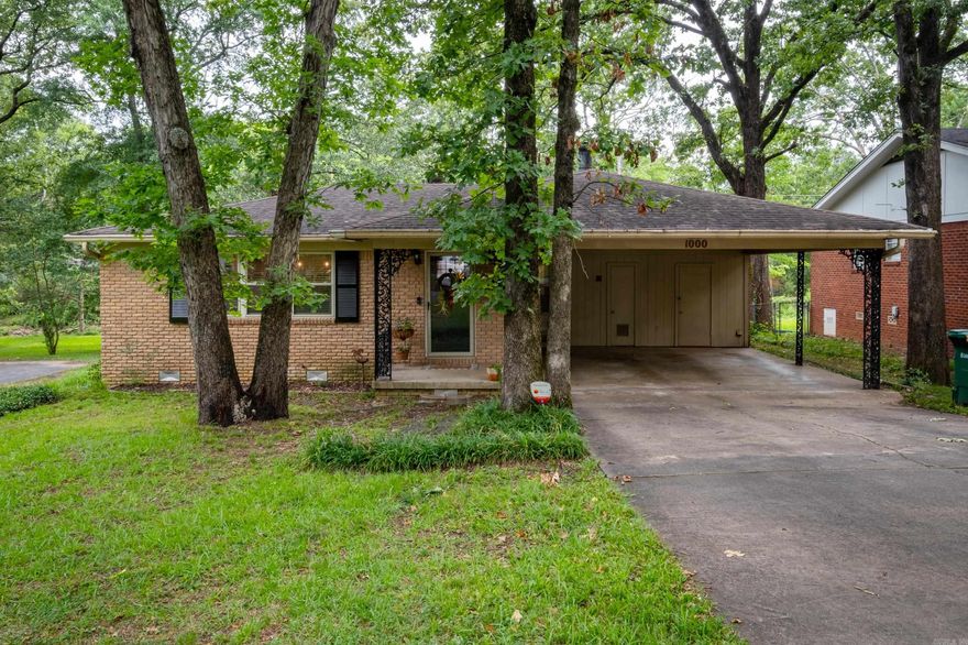 Lovely midtown home with stylish updates. This 3 bedroom 2 bathroom house is move in ready. The great room welcomes you with beautiful original hardwoods, a focal wall and arched doorway. The updated kitchen offers new cabinetry, quartz countertops, backsplash, lighting, gas range, refrigerator and island. Just off the kitchen you will fing a welcoming gas fireplace. This area may be used as a dining room or hearth room. All bedrooms have original hardwood floors. Enjoy the outdoors with a large flat back yard and patio for entertaining. Super convenient location! This house is just minutes from all the best of Little Rock. Refrigerator, draperies, Ring doorbell and Google thermostat convey.  Agents - see remarks.