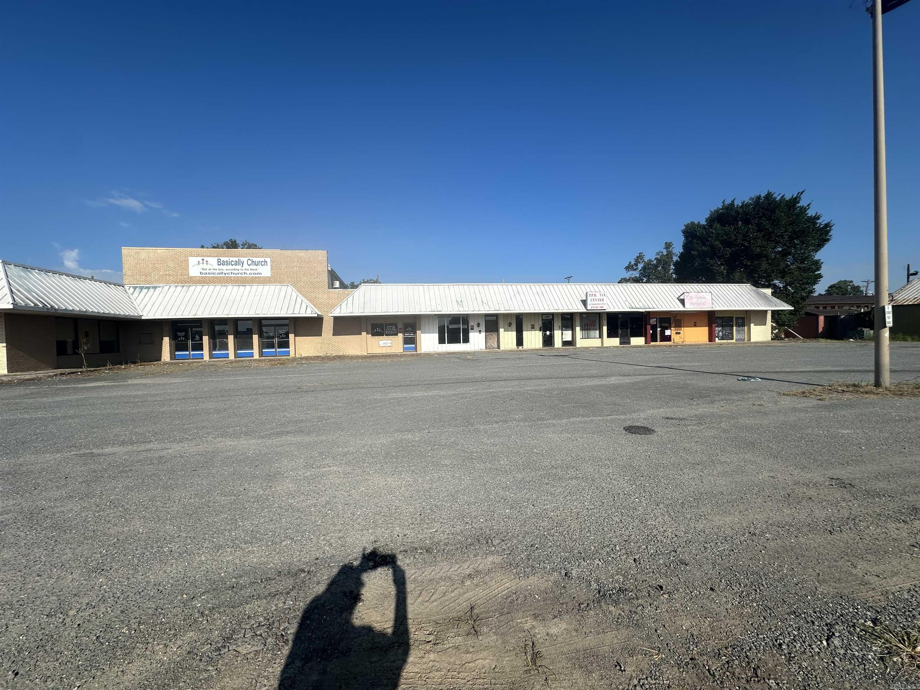 This metal-framed commercial building features 8 separate units ready to be leased, offering excellent highway frontage and high visibility. The property includes glass entrance doors for each unit and ample parking. Previously occupied by a movie theater, church, tax office, and music studio—this property offers endless potential for a variety of business ventures. Located directly across from Delta Memorial Hospital—ideal for medical-related businesses or service providers. Interior photos coming soon. This complex is being marketed individually, so a final legal description will be determined once a buyer selects the specific unit(s) they wish to purchase. A survey will be completed at that time. Whether you’re looking for investment income or a new location for your business, this property delivers location, space, and opportunity.