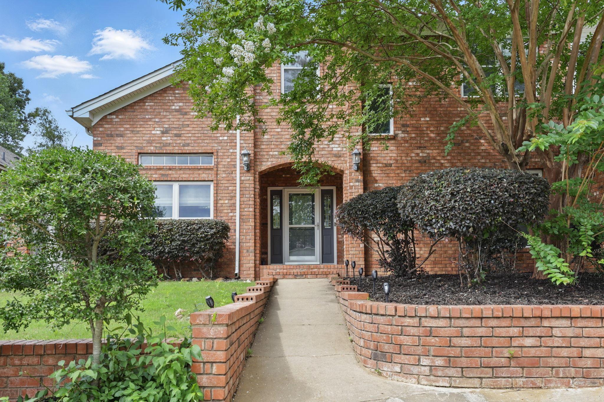 Seller is motivated and relocating due to a job transfer! Tucked away in Maumelle, this spacious home offers flexible living and great updates in a peaceful setting just minutes from I-430. Recent improvements include a NEW ROOF and HVAC system with ALL-NEW DUCTWORK (2023). The seller is also offering a 1-year home warranty for added peace of mind. The main level features a welcoming living room, formal dining, eat-in kitchen, and a large office that could serve as a 5th bedroom. A guest bedroom with access to a full bath and the laundry room adds flexibility for guests or multi-gen living. Upstairs, enjoy a second living area with vaulted wood ceilings, wet bar, and a beautiful stone fireplace that opens to the expansive primary suite. The primary features high ceilings, private deck access, a second fireplace, and a large en-suite bath. From the top floor deck, take in beautiful vista views and views of the Arkansas River. Two additional bedrooms share a full bath, and a cozy reading nook adds charm. All mounted TVs, washer & dryer, and refrigerator convey with an acceptable offer. HOA includes park, trails, boat dock & more.