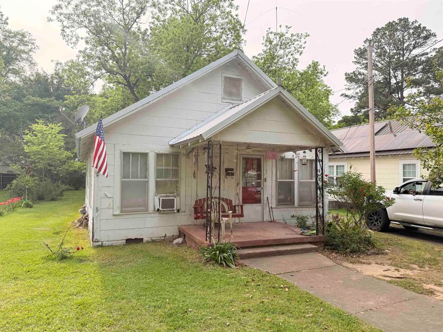 3-bedroom fixer-upper with timeless appeal — sold as-is and ready for restoration! This classic single-family home sits on a spacious lot with mature trees and a peaceful, established neighborhood setting. Featuring a welcoming front porch, metal roof, and original character, it offers excellent potential to be restored to its former glory. While the interior requires significant work     (including cleanup and updates), this is a solid    opportunity for investors, handy buyers, or  visionaries looking for a project with real heart.  Bring your tools and creativity — this one has the  bones to shine again! Sale is AS IS, WHERE IS and subject to court approval.