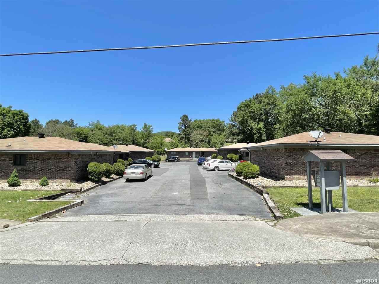 INVESTORS TAKE NOTICE! A total of 15 units (7 duplexes and 1 stand alone unit) situated right across the street from Hot Springs Family Park. The units are each 2 bedroom, 1.5 bath and have been fully occupied for years. A handful of the units have been recently remodeled. Units are separately metered and tenants pay all utilities. Area for covered parking. Current owner has kept rents low for years and has only recently started increasing rents to market rate as units turn over. Room to increase rents!