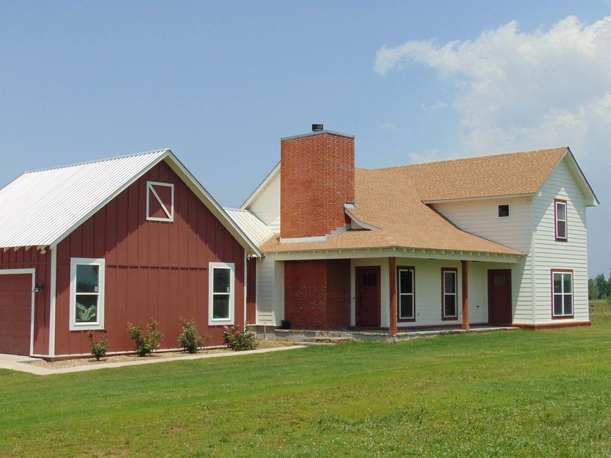 Beautiful and unique country, farm style home sitting on approximately 2 acres.  10' ceiling in main living areas, hardwood floors throughout except laundry room and baths, family room has a wood burning stove and is open to the kitchen and dining area.  Spacious kitchen with large breakfast bar, 5 burner gas stove (propane), butcher block countertops, French doors from dining area to 22x14 covered deck w/vaulted ceiling.  Located on the main level is the large primary bedroom & bath with a tile walk in shower and double vanities.  A large office (currently used as a bedroom) a half bath, and spacious laundry room with extra storage is also located on main level.  Upstairs are the two huge bedrooms, bathroom with double vanities plus a 10x14 storage room.  A storm shelter is located under the house.  16x16 storage building with side covered space, metal roof on house garage, small orchard next to the house with apples, pears, plums & a mulberry tree.  This is a gorgeous property!  Must see!!