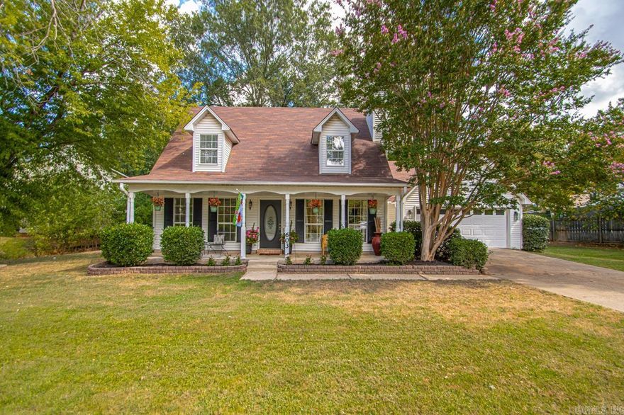 Nestled in the heart of Bryant, this cozy home with a beautiful front porch is ready to welcome you to calm, peaceful evenings with rocking chairs, sipping iced tea and solving the world‘s problems. As you enter the home, you will love the cottage style ambience and the beautiful luxury vinyl floor wood planks. The neutral color palette makes for a nice and airy feel with the painted brick fireplace as the focal point of the living room. As you enter the eat in kitchen, you will love all the natural light and a space big enough for hosting Sunday lunch with the family.  The moss-colored painted shaker cabinetry looks like something out of a magazine. The home boasts three nice sized bedrooms with brand new carpet and walk-in closets. Two of the bedrooms have the perfect place for little reading nooks in the dormer window alcoves overlooking the front yard. It has two full bathrooms and one 1/2 bath with modernized countertops and fixtures. The large backyard has plenty of room for grilling with friends & room for the kids to run and play. Imagine what the mature trees are going to look like in the fall.  This home is ready to welcome a new family to the neighborhood.