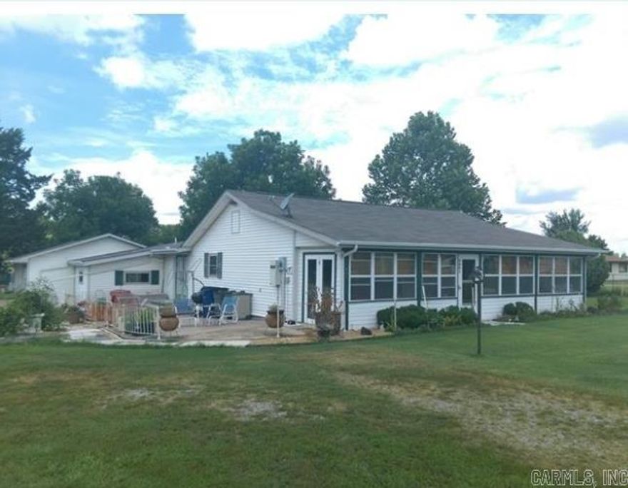This spacious property offers endless possibilities for homeowners, entrepreneurs, or investors. Priced at $224,500, it sits on approximately 1.29 acres (M/L) and features a 2-bedroom, 2-bathroom home with 2,152 square feet of living space and an attached 3-car garage. The property includes several outbuildings: a 24x44 greenhouse ideal for gardening or small-scale agriculture, a 21x50 shop with dual doors for easy access and versatility, and a 15x20 tool shed for additional storage or workspace. Recent updates include a 4-year-old roof and heat pump, along with a new pressure tank and water heater. An exterior wood furnace offers an efficient alternative heating option. Whether you're launching a home-based business, starting a hobby farm, or creating rental opportunities, this property offers the flexibility to match your vision. With ample room to expand and a solid foundation already in place, it's ready for you to make it your own.