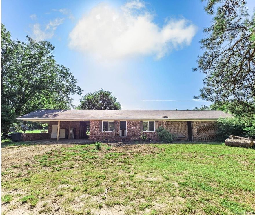Beautifully updated home on acreage! Open floor pan with a modern and tasteful farmhouse approach. From the minute you walk in the door, you'll feel right at home with the quality workmanship with a nod to rustic charm.  The primary bedroom features high ceilings with a more than generous walk-in closet, barn wood feature wall, and spacious bathroom. Also included in the heated & cooled space is the sunroom off the laundry room.  Don't miss the finished bonus area under the carport which features central heat & air and a 1/2 bath.   The property also includes a 20'x40' barn with electricity and a thick slab foundation. Cross fencing enhances the use of the property if you are seeking homesteading and livestock opportunities!  Improvements made in 2017: new roof, new windows (except in sunroom), new septic system, new CH/A, new electrical, new plumbing (except in bonus room), new sheet rock through out, new flooring, new vanities, new tubs, new fixtures, new cabinets, new doors, new appliances, granite countertops, and beautiful, rustic wood accents.