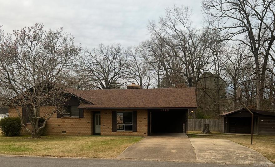 Great starter home or investment property. Home features a grand living room with beautiful fireplace, large eat-in kitchen with dining area, 3 bedrooms, one and a half bathrooms, central heat and air, large yard with a huge storage shed with concrete floors.