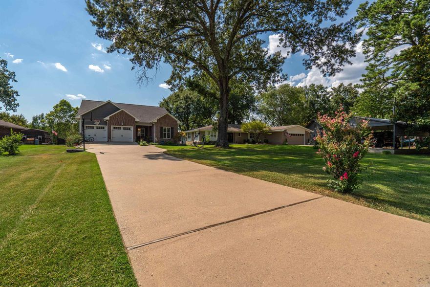 Custom lake house in Caroline Acres one mile off Hwy 7 South, built Craftsman style in 2016.  This home sits in a quiet cove with nice views of Lake Hamilton from almost every room.  It contains 4 bedrooms, 2 ½ baths and bunkroom that sleeps 6, great home for entertaining whether inside or out.  Spacious back porch to enjoy the western sunset, watching kids swimming, fishing from the boardwalk or roasting marshmallows around the firepit.    The first level of this open floor plan home hosts the primary bedroom suite while family and friends bunk upstairs. Wonderful neighborhood with community park/boat launch area.  Great location, shopping nearby, and only 15 minutes to Oaklawn and Garvan Gardens.