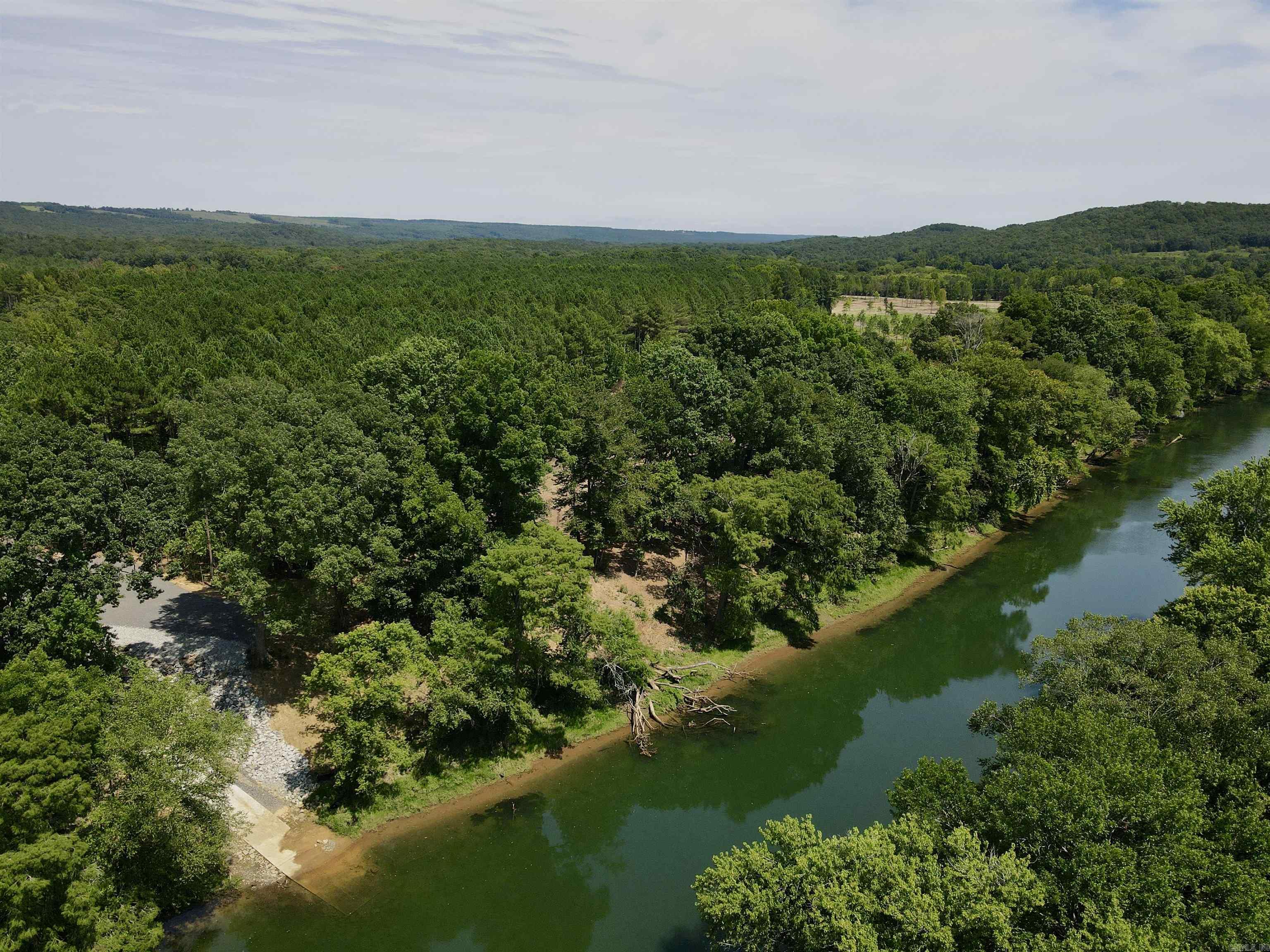 Lot #27 in The Pines on The Little Red. Affordable lot in a beautiful setting with private boat launch access! Located just north of Pangburn and just south of Heber Springs, this is a perfect, affordable location for rural living. Access to a private, gated boat launch that's 3.2 miles upriver from Ramsey's Access, and 2.6 miles downriver from Dripping Springs Access. Don't overlook the small parcel size for opportunities to view wildlife too. There is an abundance of wildlife on this property. If you're looking for privacy and the tranquility of the outdoors, this property is well suited for you. A mature pine buffer on the north, and tucked away off of a county road, this property is a peaceful getaway. Conveniently located just outside of Pangburn, and minutes from Heber Springs, this property is in an outstanding location. The country life with the amenities of town just a few miles down the road. The Dam Site Boat Launch on Greers Ferry Lake is just 15 miles to the north.