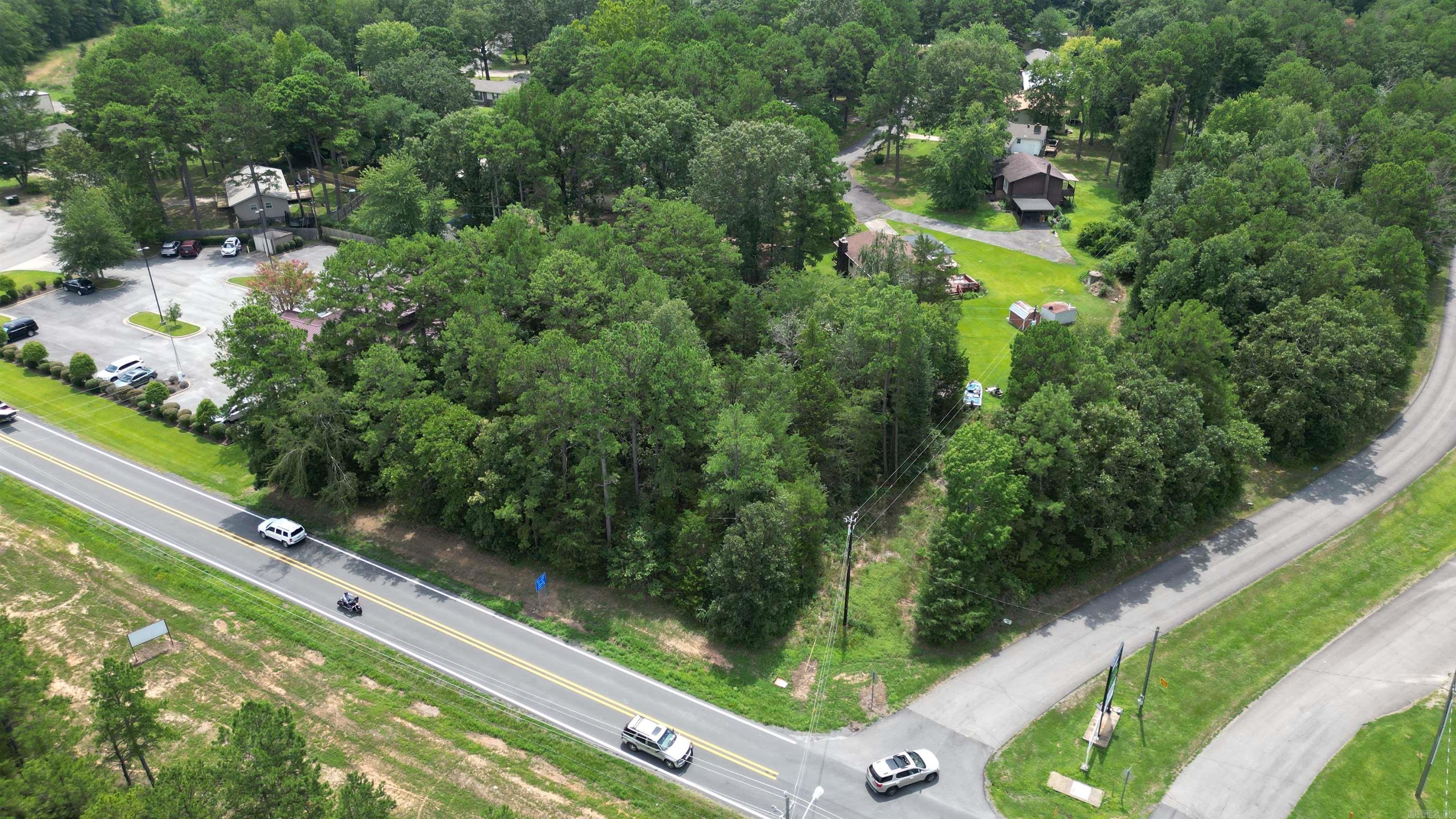 Commercial real estate opportunity in Heber Springs! This approx 3/4 acre corner lot is zoned for commercial use and boasts prime location adjacent to medical offices. An ideal business location on the main commercial highway in town and close proximity to the Heber Springs Community Center. Per ARDOT, daily traffic count estimate is 5900. Per Seller First Electric will relocate existing electrical facilities for proposed viable commercial projects.