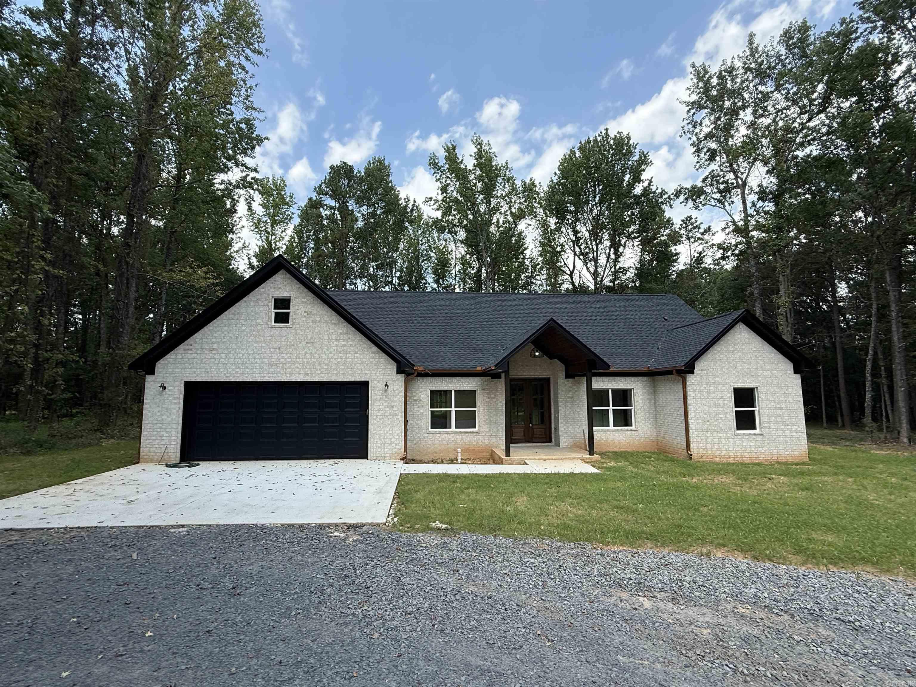 Welcome to this gorgeous country home! This Approx 2,840 sq ft home is a 4-bed, 2.5-bath, 1-bonus room (could also be 5 bedroom) boasting a split floorplan along with an ultra open concept! The living room, kitchen, & dining room were made to entertain! Come check this home out! This one is a looker! Oh did I mention this one is on approx 4-acres and has an approx 330'+ driveway! Entering the home one immediately notices the large foyer & large windows ahead in the living room. Entering the spacious living room the vaulted ceiling w/wood trimmed beams produce a unique blend of light colored paints accented by dark wood stains for a perfect balance! This large kitchen is made to entertain family, friends, and more! Quartz countertops, tile backsplash, this home is upgraded at each turn. PS...Upgraded Bosch Appliance too. Also across the living room on the right side of the home are 3 downstairs guest rooms & a bath. Off the kitchen on the right is the Master suite - come see it! Plus, behind the kitchen is the massive laundry room & the stairs leading to the bonus room! Oops! I almost skipped the pantry the size of a bedroom & copper style gutters too! See Agent Remarks.