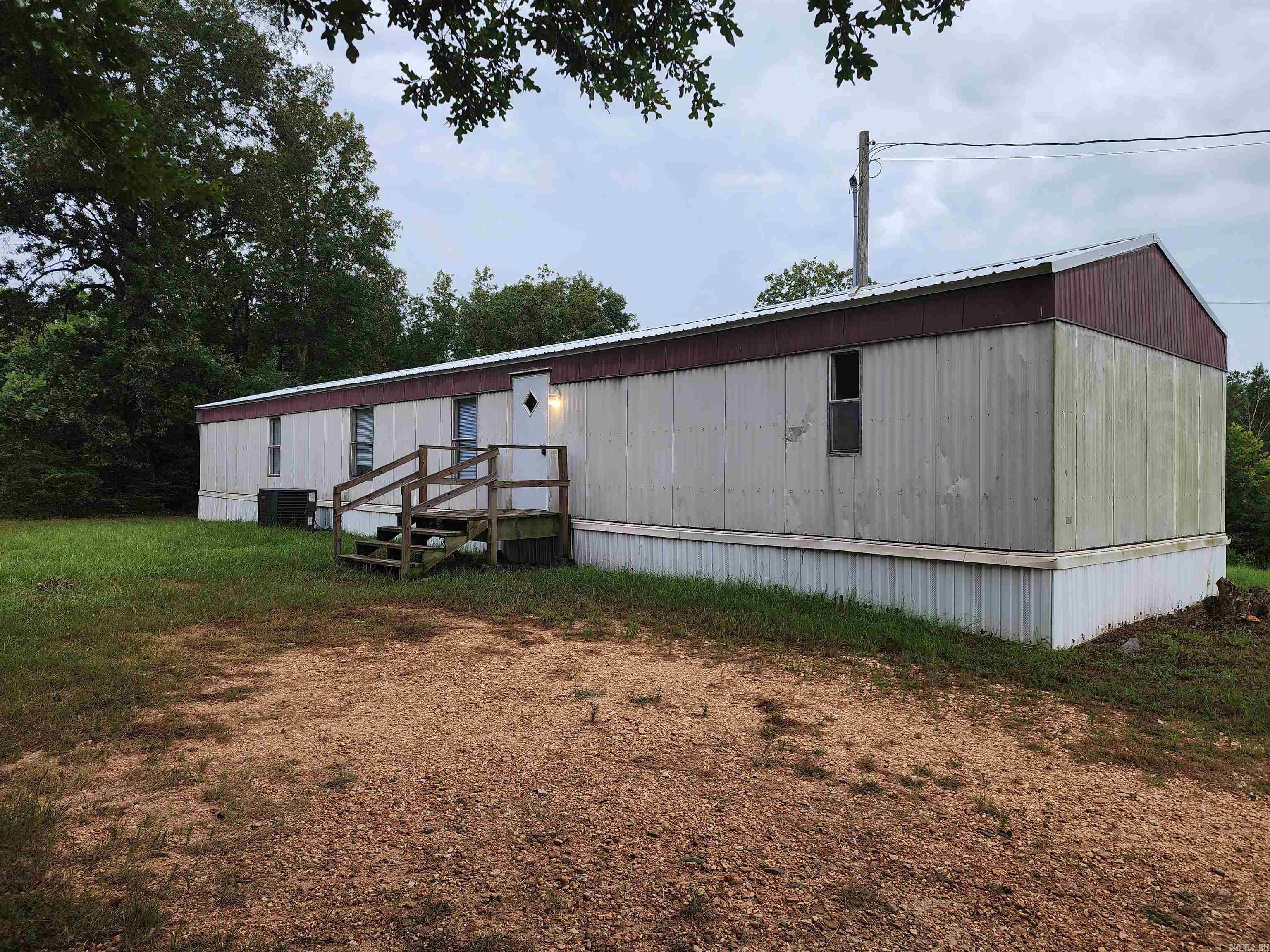 Welcome home to 1136 McPherson in Saline county's McPherson Valley neighborhood. Mobile home sitting on 1+ acres. Peaceful and quite location. New carpet, new roof, new AC. New range will be installed by seller. On Sardis municipal water. Split bedroom plan. Laundry room. Financing available with Zack Lovett at Primary Residential Mortgage, 5016817077. Agents: See showing and agent remarks.