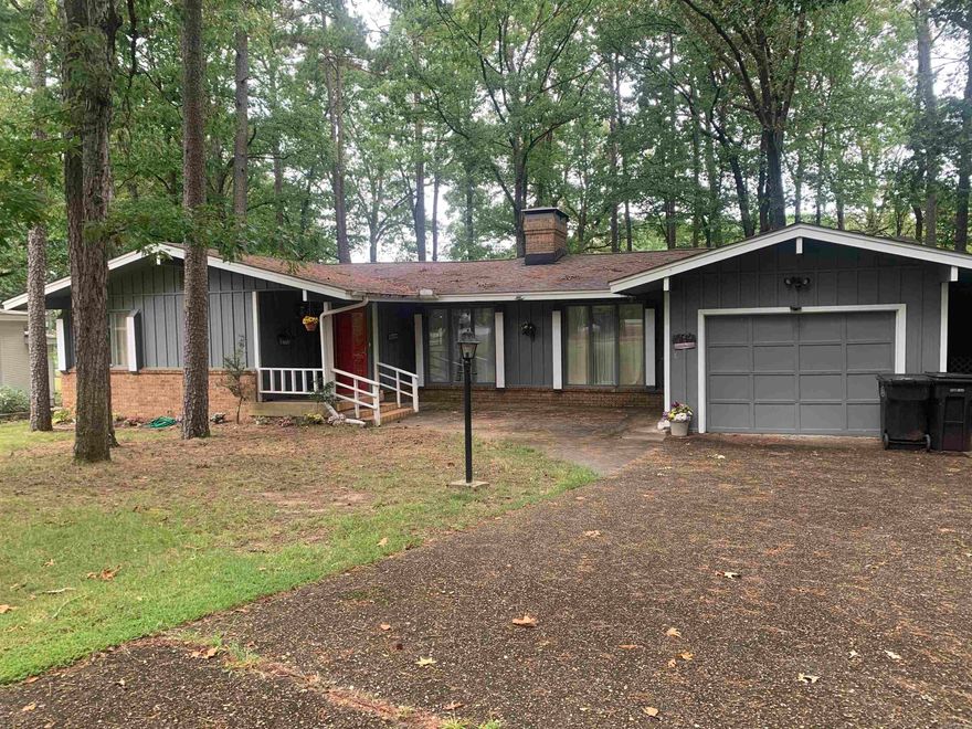 Make this your special retreat.  This home sits at the end of the lane in a cul-de-sac overlooking the #3 green and fairway of Desoto Golf Course and common space on one side.  The home has vaulted wood ceiling, wood beams, wood burning fireplace, kitchen has granite countertops and large eating area. The Arkansas room looks onto the large deck and the golf course.  There is an extra room that can be used as an office or exercise room that has windows with view to golf course. 2 bedrooms and 2 bathrooms, and laundry room.  Single car garage with carport to the side.  There is a storage unit behind the garage.  Make the home a special place with some attention.