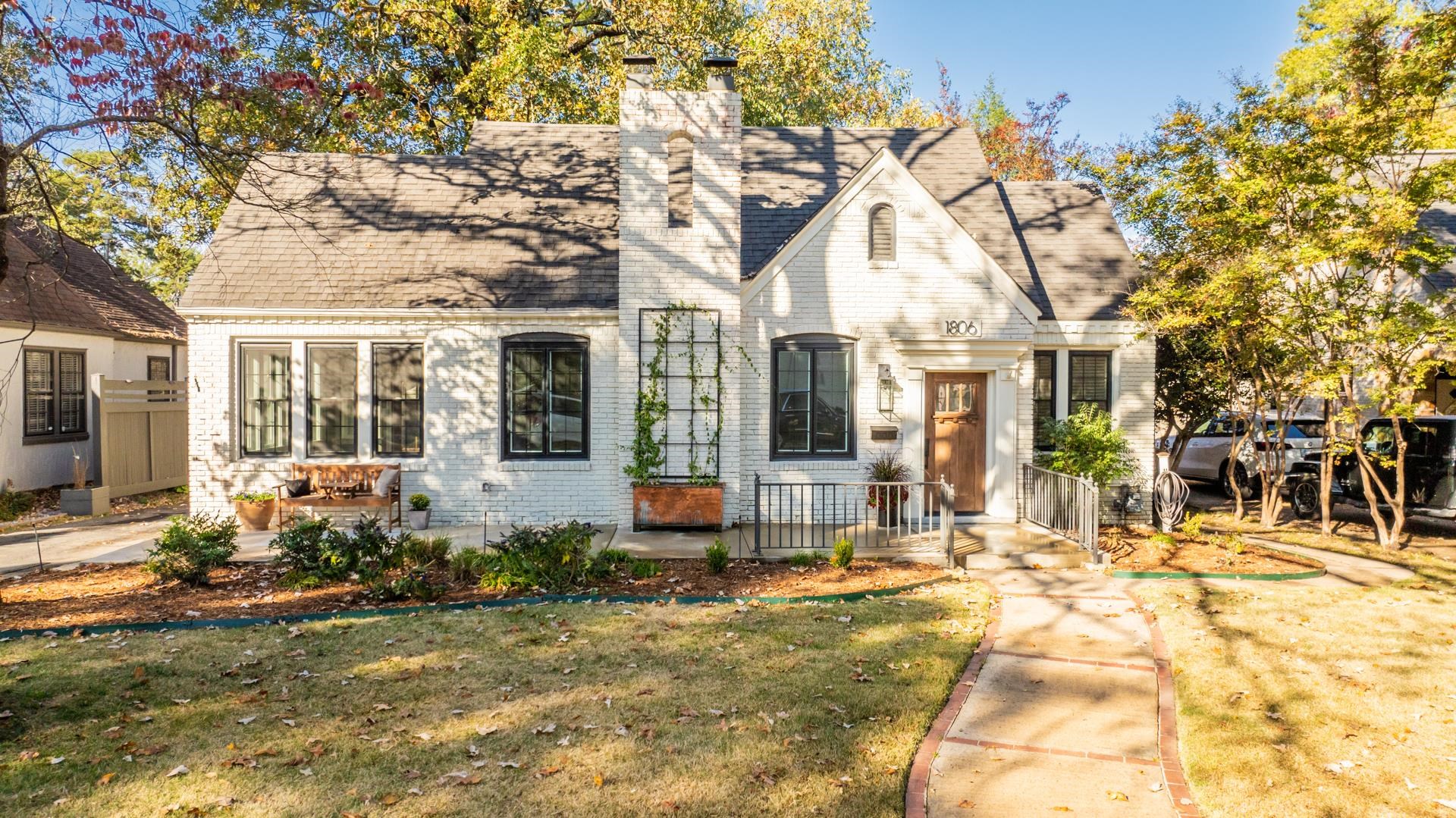 Charming home in The Heights steps from dining,shopping & the Country Club of Little Rock!Filled w/natural light,this updated residence combines modern convenience w/classic character.Recent upgrades include a freshly painted brick exterior,new windows,a new concrete front porch,beautifully updated landscaping w/new sod,repainted interior,new slate tile surround on the fireplace,all-new electrical outlets & switches,new front door & new exterior front porch light. Homes offers beautiful original floors thruout.The kitchen features freshly painted cabinetry,granite countertops,a butcher block island,double ovens,new wine fridge & new garbage disposal.The flexible sunroom can serve as a third bedroom or office,while the expansive attic offers additional living space potential.Hall Bath has been fully remodeled w/new tile flooring,tub tile surround,vanity,fixtures & lighting.The spacious private courtyard,complete w/brick back fence,wood deck & brick firepit, offers an ideal retreat.The detached garage includes additional space w/bath & shower(condition unknown)& could easily be converted into a studio apartment. With timeless charm & extensive updates, this home is truly exceptional!