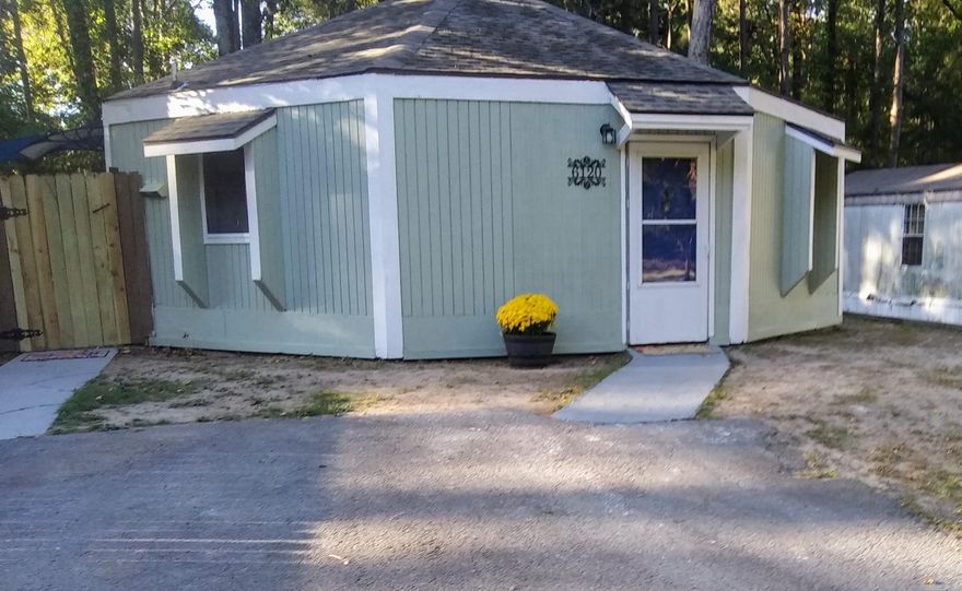 An open concept with high ceilings makes this little house seem so much larger than it is.  Kitchen is all electric, stove and refrigerator remain.  Area off the kitchen for washer and dryer.  Two bedrooms with nice closet space.  The roof is new, as well as paint inside and out, flooring and so much more. Out the back door you will find a partially fenced yard and a cute patio space for relaxation.