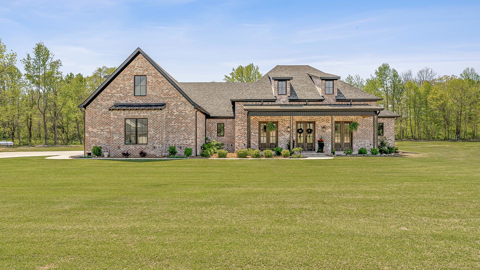Discover your dream home in this serene neighborhood, featuring a stunning 4-bedroom, 3.5-bath residence that boasts over 4,000 square feet of luxurious living space. The all-brick exterior and meticulously landscaped yard welcome you, while the spacious foyer leads to a private office with built-in bookshelves. The elegant living room, complete with a brick fireplace, seamlessly connects to a gourmet kitchen adorned with quartz countertops, an expansive eight-foot island, and top-of-the-line appliances, including a gas 6-burner cooktop. Enjoy the convenience of a large walk-in pantry equipped with additional cabinetry and a beverage fridge. The generous secondary bedrooms share a well-appointed Jack and Jill bath, while the impressive primary suite features dual bathrooms, each with walk-in closets and exquisite tile finishes.