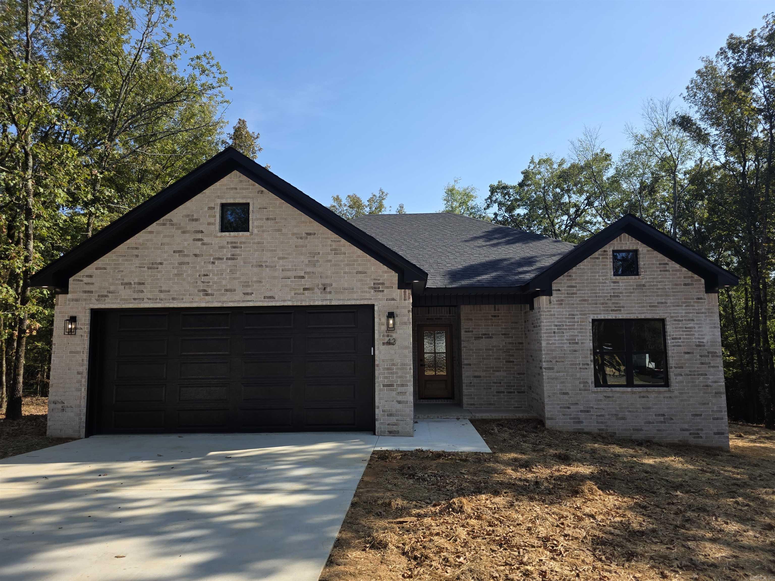 Ready to move in, brand new construction home on a dead-end road in Greenbrier School district! This home is stunning with quartz counter tops in kitchen and both bathrooms. Split floor plan with tray ceiling in primary bedroom and vault ceiling in living room. Walk in closets in all three bedrooms with the primary en-suite bathroom having 2 separate closets. Thoughtfully convenient motion light switches in entry way from garage, the pantry, and both primary closets. Hunter brand fans and waterproof luxury vinyl plank flooring throughout. Very private wooded back yard with just a little over an acre lot. Conveniently located to Hwy 65 and all that Greenbrier has to offer.